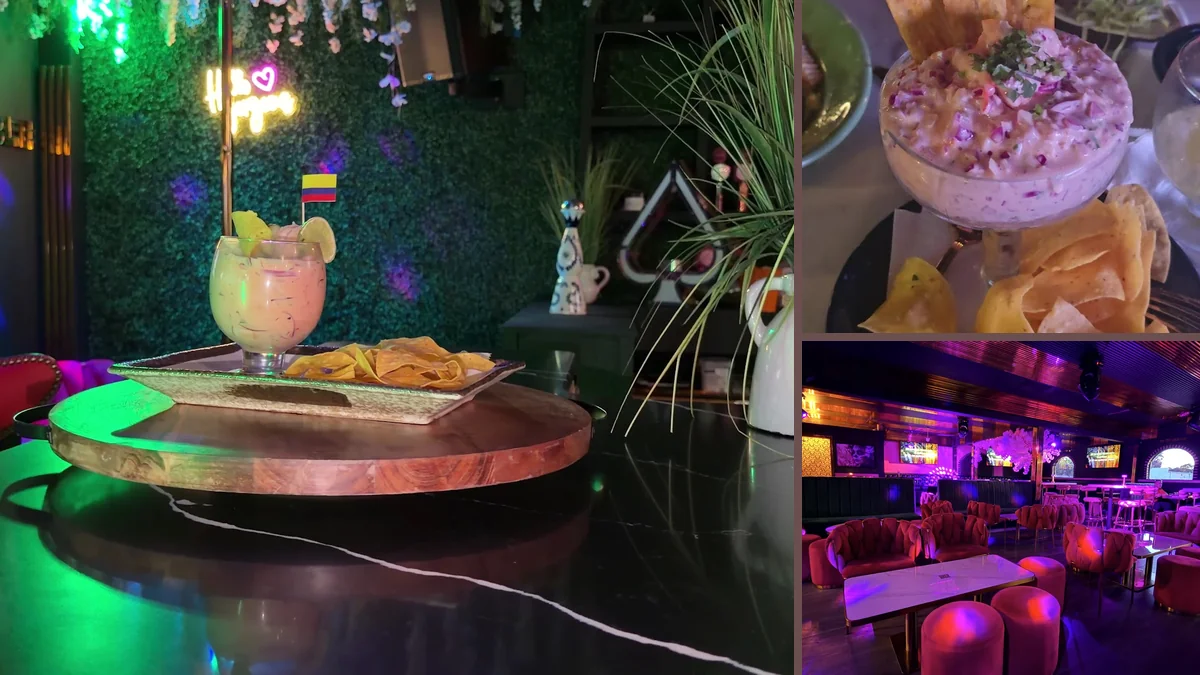 Warm bar interior with tables and colorful decor.